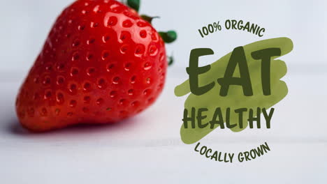 animación de comer texto saludable en verde sobre fresas orgánicas frescas