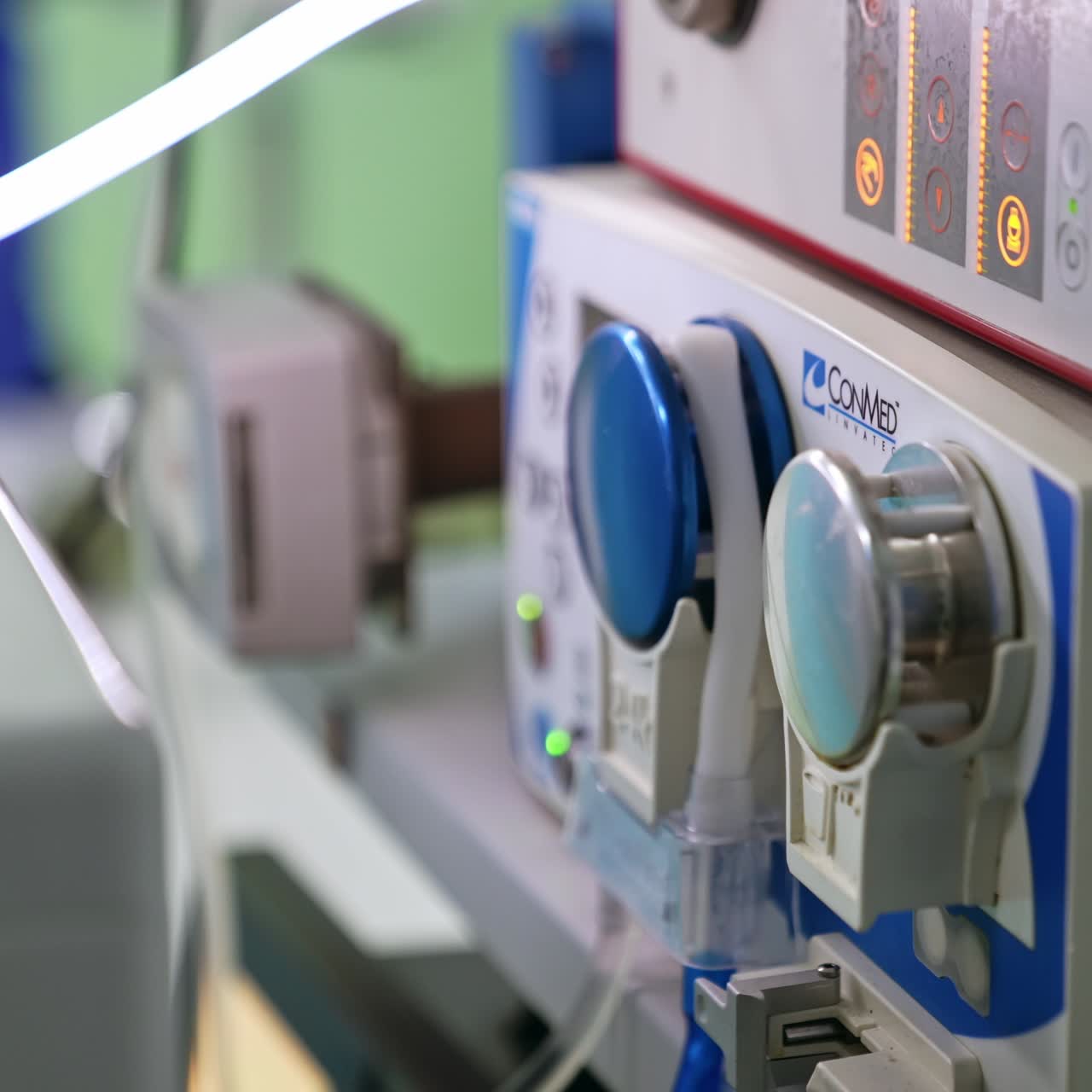 A roller at the equipment spinning and turning the tube. Close up. Advanced equipment working at surgery room during operation