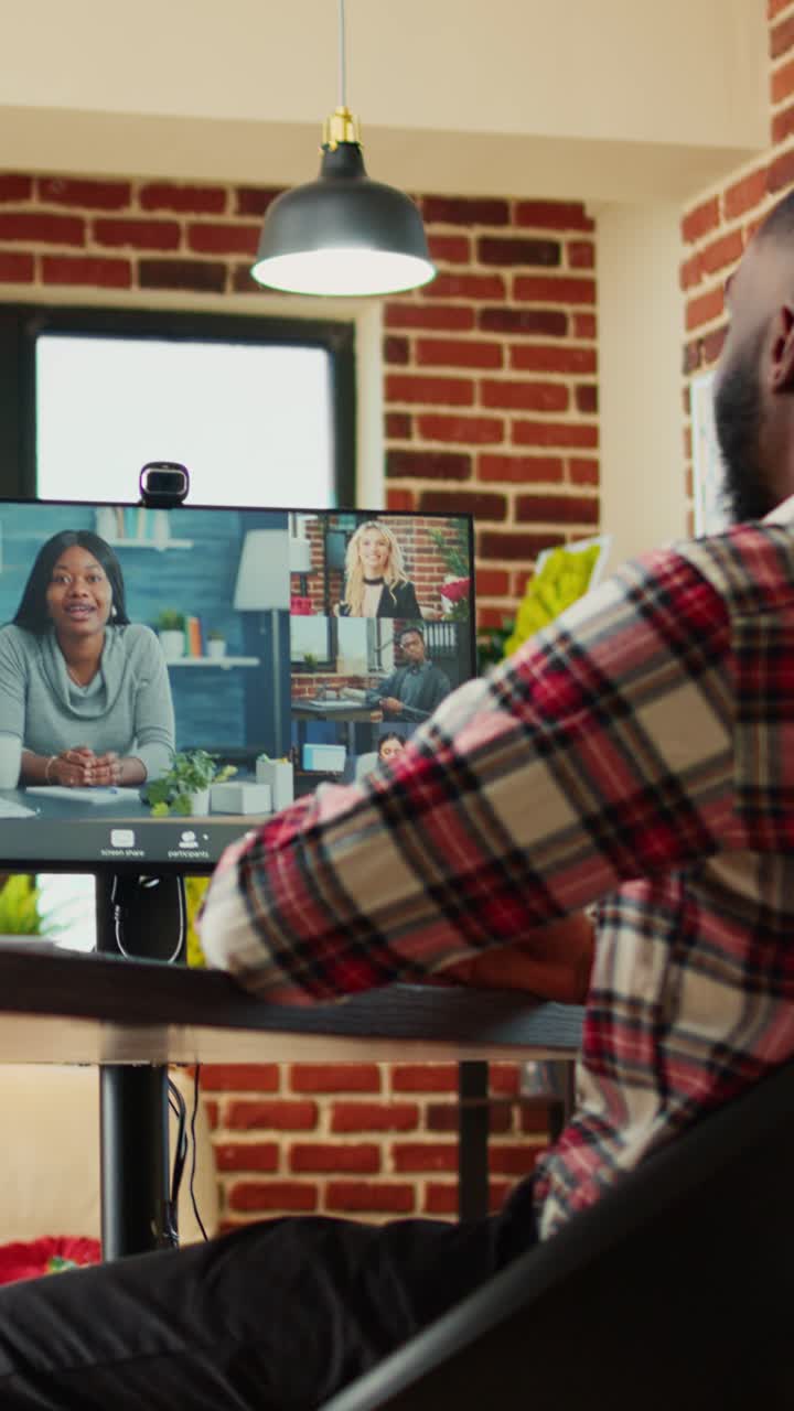 Man attending a virtual conference on computer