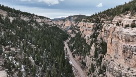 steep rock walls through state highway 14 through cedar canyon, utah, usa