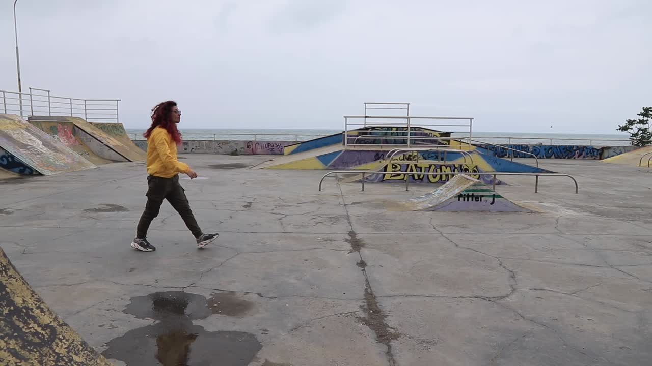 Woman walking in a skatepark near the ocean