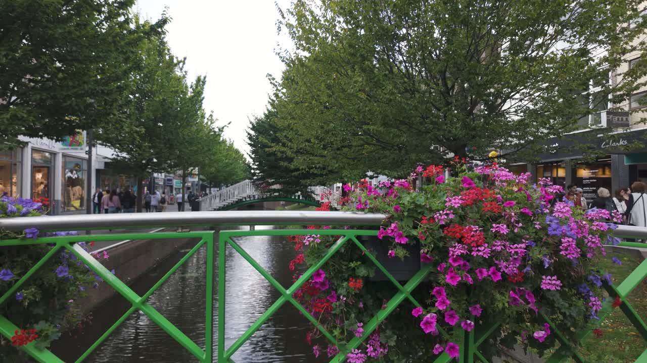 Beautiful Canal Street Scene with People Walking