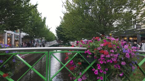 beautiful canal street scene with people walking
