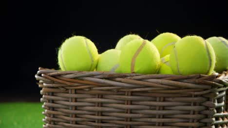 tennis balls in wicker basket at studio 4k