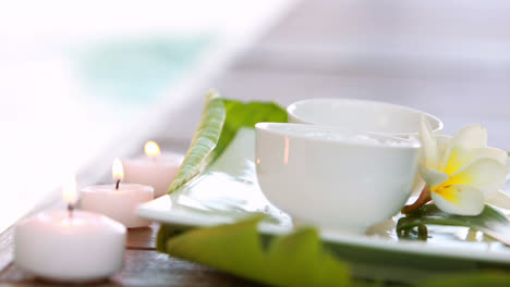 Beauty-treatment-in-bowl-presented-on-plate-with-leaves