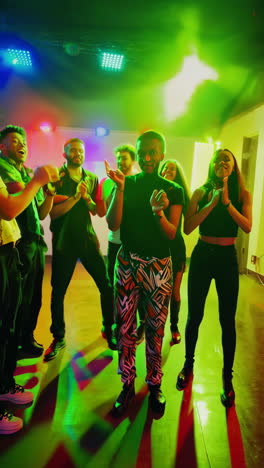 friends having fun dancing at a lively party