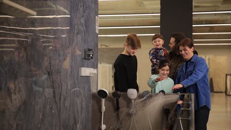 family shopping for bathroom shower heads