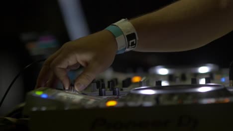 DJs-Hand-Turning-Knobs-On-DJ-Deck