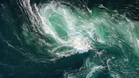 blue waves of water of the river and the sea meet each other during high tide and low tide.