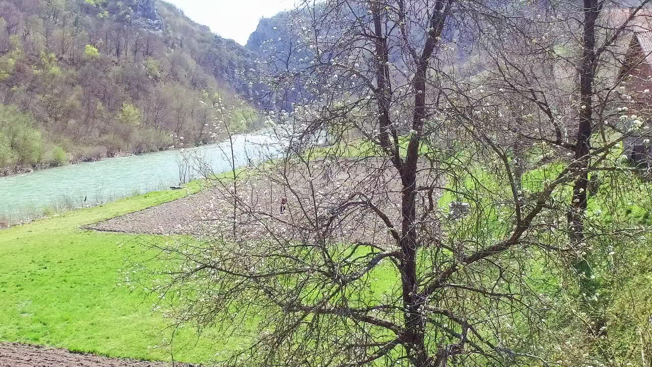 Aerial view of farmers working near the river