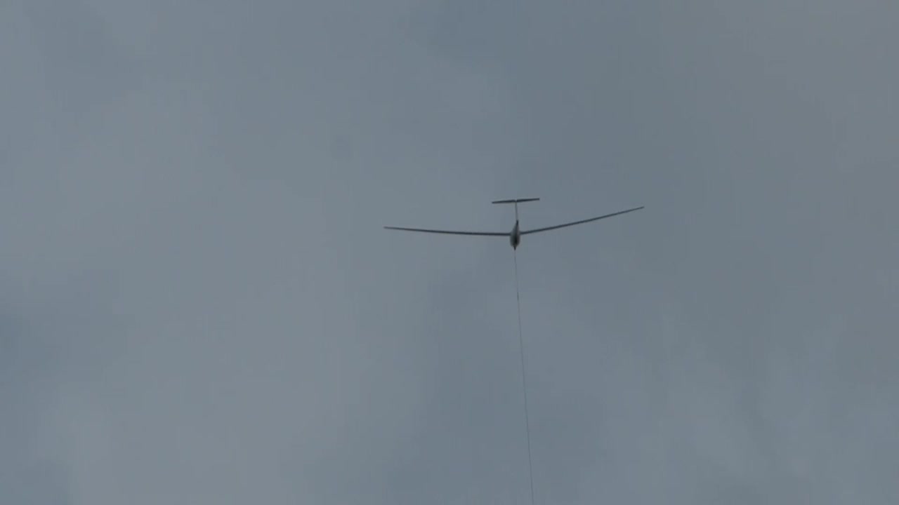 aircraft is pulled into the air with a cable winch and then unhooks this cable in the sky