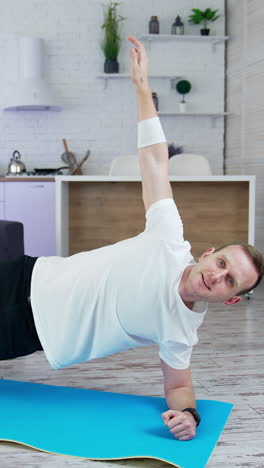 young lifestyle sportsman working out at home. training body indoor by strong handsome man. full length vertical video