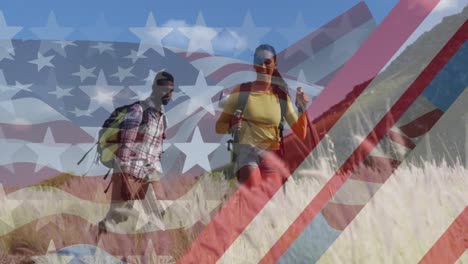 animación de la bandera estadounidense sobre una pareja diversa sonriente caminando en las montañas