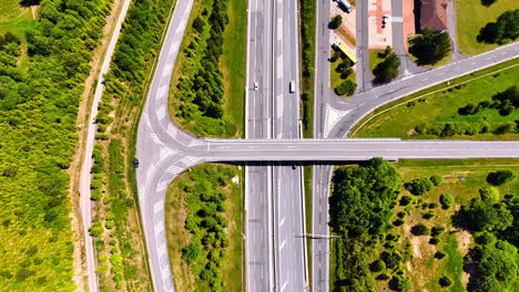 flight over the highways and freeways with lawns and bushes around. flight over the road system in the countryside of slovakia