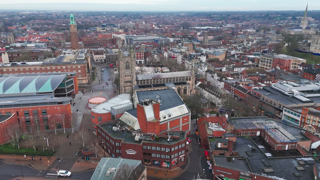 Norwich, norfolk showing churches, turrets, streets, and vibrant shops, aerial view
