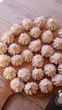 preparing khinkali - georgian dumplings