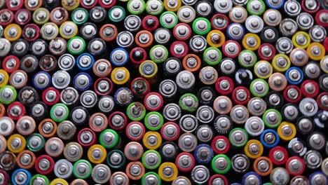used batteries are stacked in the center types aaa aa 9volt top view background used batteries are stacked in the center types aaa aa 9volt top view background texture of electric batteries