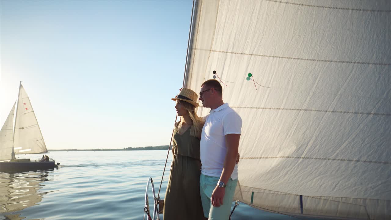 Couple Sailing on a Boat at Sunset