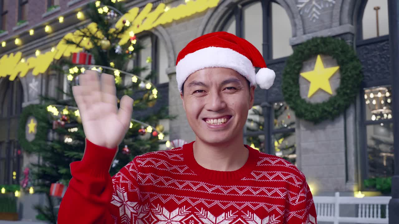 산타 모자를 입은 남자가 크리스마스 때 인사를 흔들고 있다