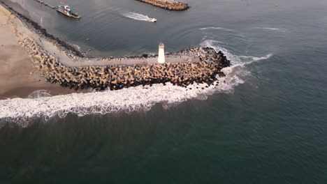 aerial view of santa cruz breakwater lighthouse shot in 4k high resolution