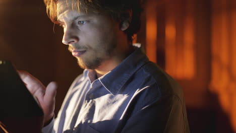 man using tablet computer touchscreen close-up touching