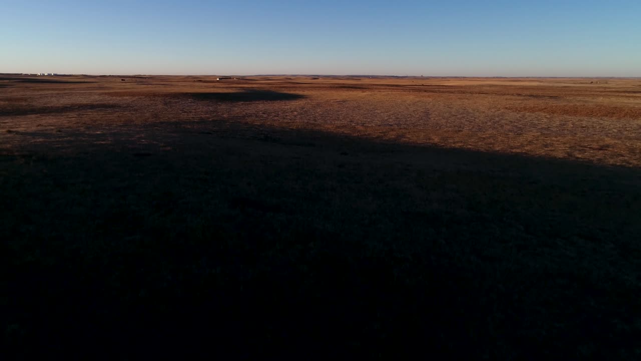 An ascending flight during sunset to show the vastness of the North American Great Plains