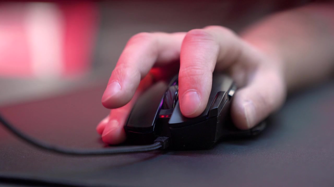 Close-Up of Hand Clicking and Scrolling a Gaming Mouse