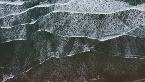 A-view-from-above-of-the-waves-crushing-on-the-sand-in-Tampico,-Mexico