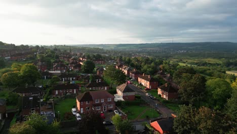 Yorkshire's-urban-living:-Aerial-drone-footage-of-the-UK's-red-brick-council-housing-in-the-morning-sun,-with-homes-and-lively-streets