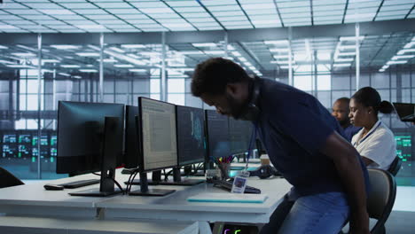 team of it professionals working in a data center