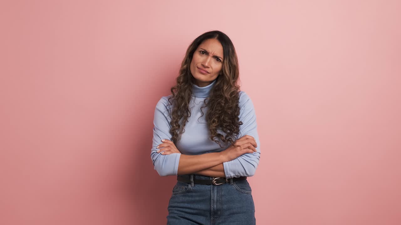 Upset woman with arms crossed standing disappointed