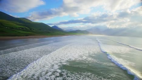 Repetitive-sea-waves-and-green-hills-4k