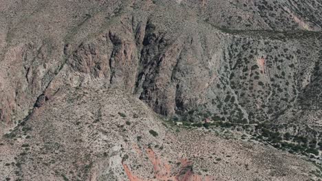 Aerial-View-of-Rugged-Cliffs-and-Rocky-Desert-Terrain-in-Amaicha-del-Valle,-Tucumán