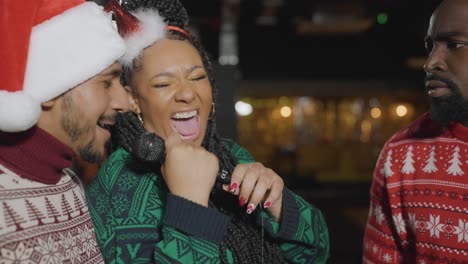 Close-Up-Shot-of-Diverse-Group-of-Friends-Singing-In-a-Karaoke-Bar