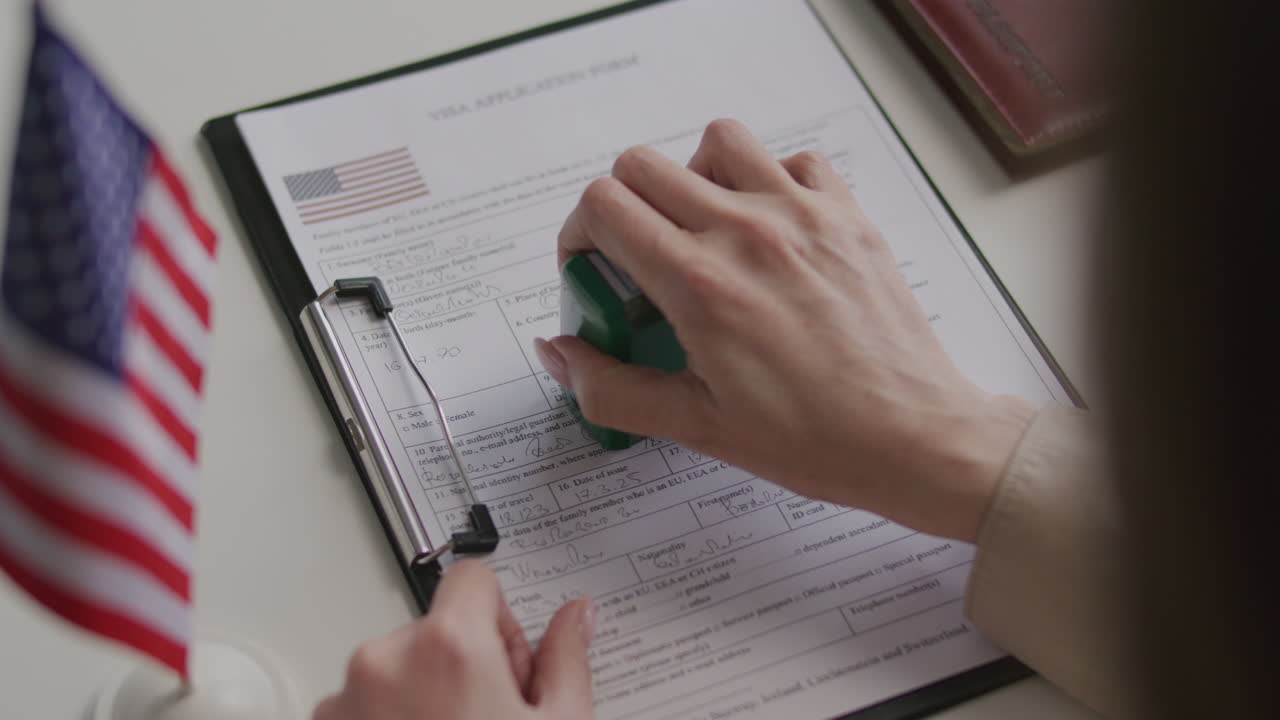 Examining and Approving Visa Application Document with Official Stamp