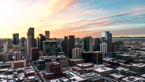 Aerial-hyperlapse-of-a-glowing-sunrise-behind-Denver,-Colorado