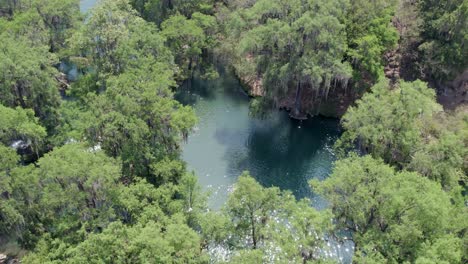 Aerial-view-of-people-bathing-in-the-river-and-waterfalls-in-San-Luis-Potosi