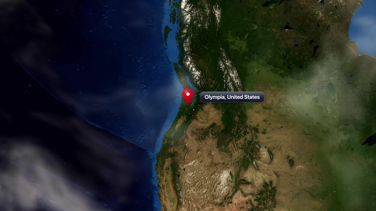 Satellite camera zooms from outer space into North America, pinpointing Olympia, Washington, United States. Includes NASA public domain imagery.
