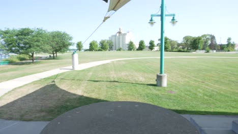 Pedestal-motion-upward-to-reveal-Drone-as-it-takes-off-for-flight