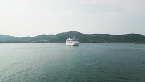 cruise ship in zihuatanejo bay, in the pacific ocean, on vacation. 4k drone shot