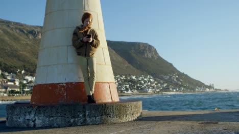 woman using mobile phone at dock 4k