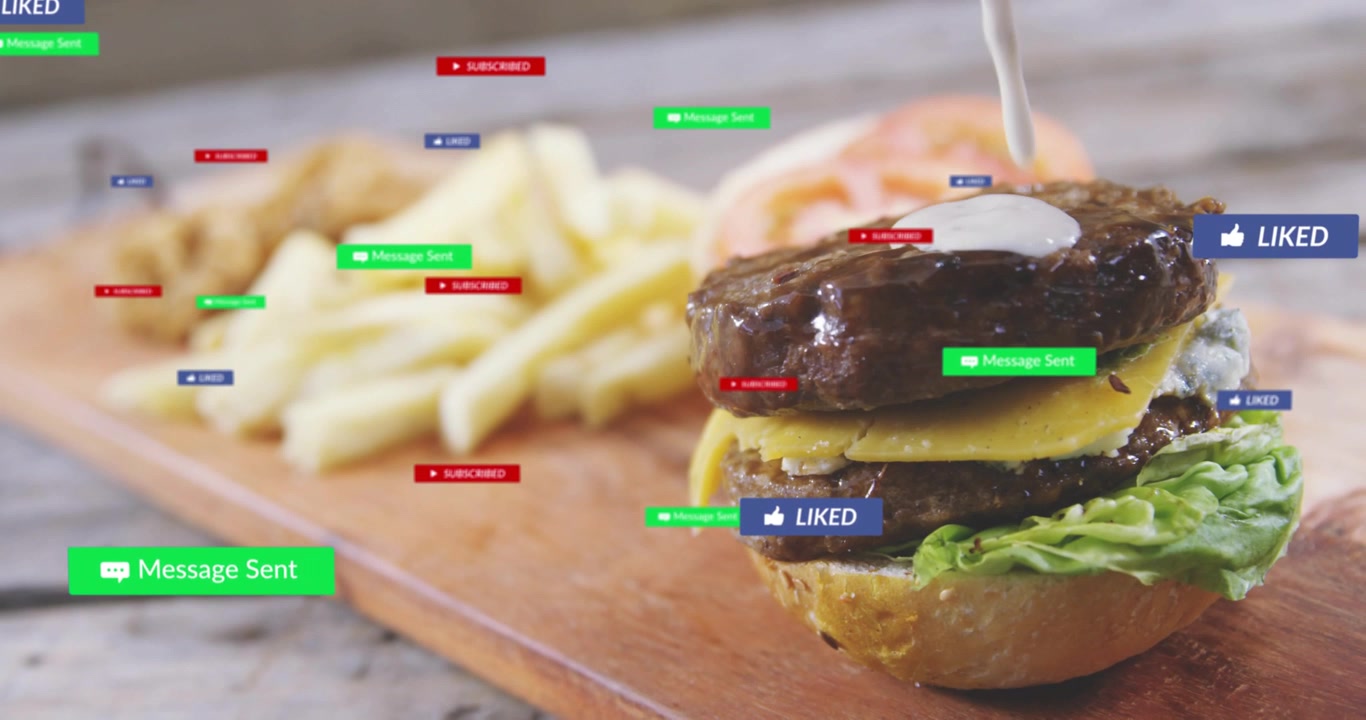 Vertical video: Badges signaling likes around burger on board as sauce dripping, fading, copy space