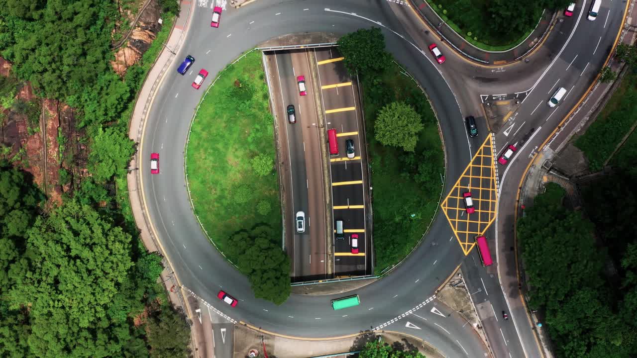Drone Aerial Top View of Flyover inside intersection commercial and residential downtown, Mong Kok Kowloon of Hong Kong City Skyline. Rush hour at Kowloon of Hong Kong. Bird's eye view.