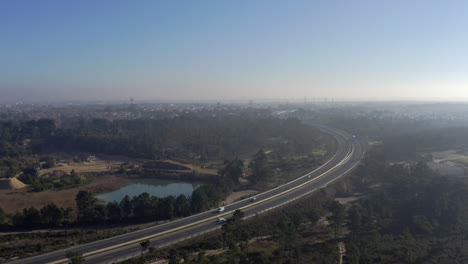 Aerial-view-of-a-landfill-lake-near-a-highway