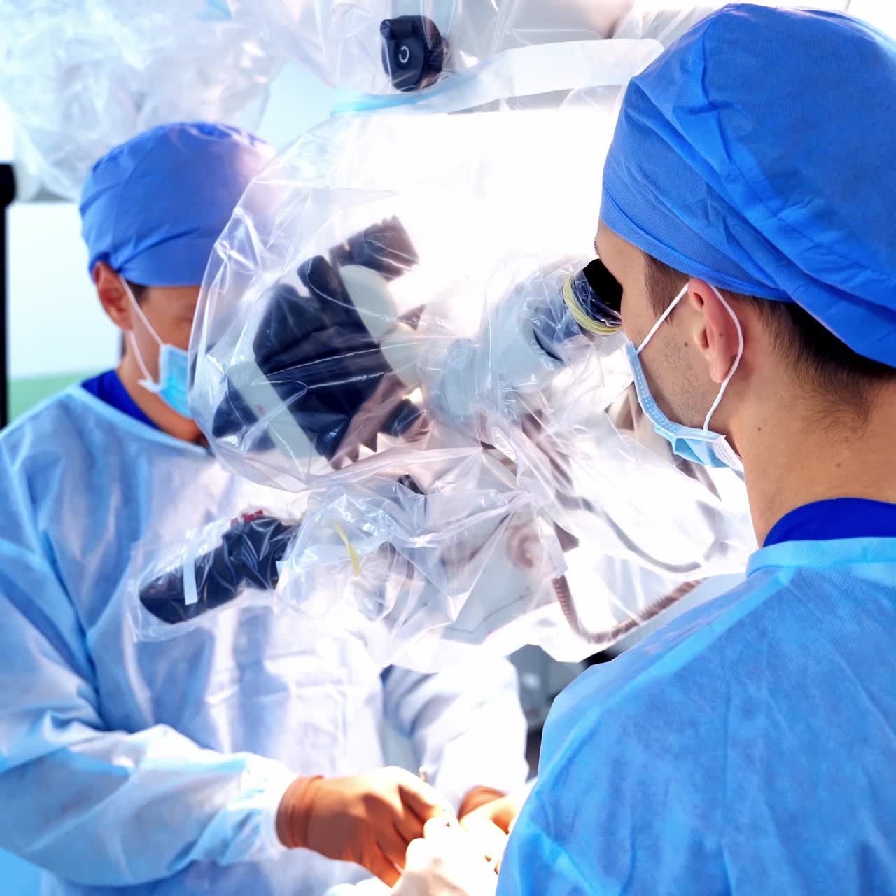 Surgeon using operating microscope