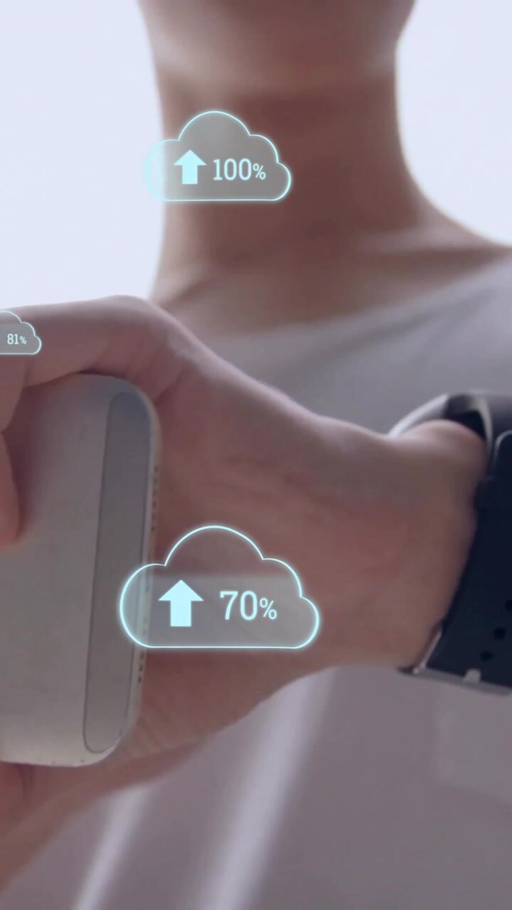Animation of data processing and clouds over caucasian man using smartphone