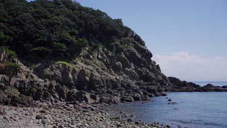 coastal cliffs of tomogashima, sunny day over seto inland sea, japan