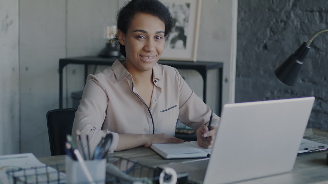 African American Woman Working at Desk