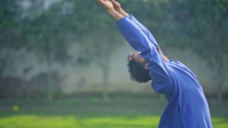 indian man doing yoga stretching exercise