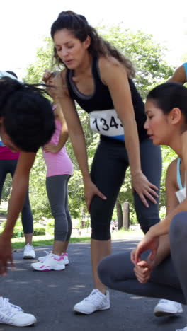 group of people stretching before a race